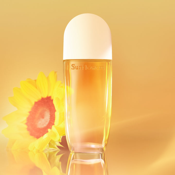 Perfume bottle with a sunflower on a yellow background